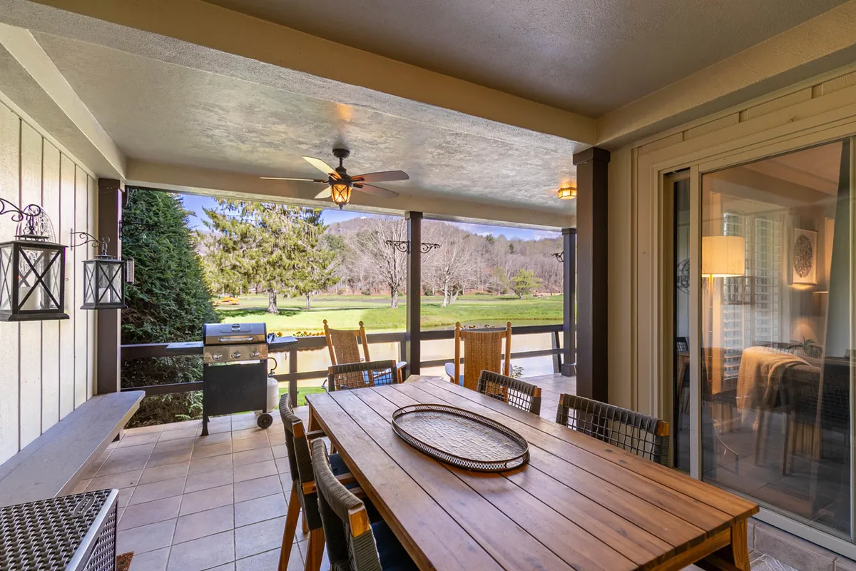 An inviting outdoor dining area equipped with a table and grill, set against a scenic landscape backdrop. The space is designed for al fresco meals, social gatherings, and relaxation, encouraging families to spend quality time together outdoors after days of exploring.